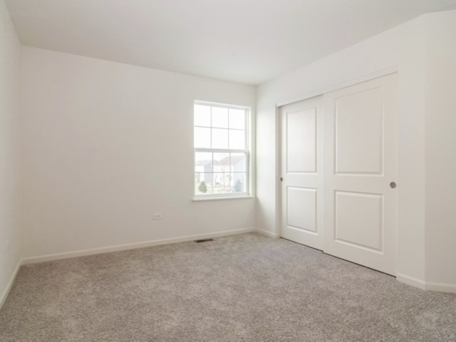 3118 Patterson Road Montgomery, IL 60538 - Photo 14 of 23 an empty room with windows