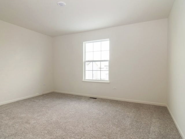 3118 Patterson Road Montgomery, IL 60538 - Photo 15 of 23 an empty room with a window