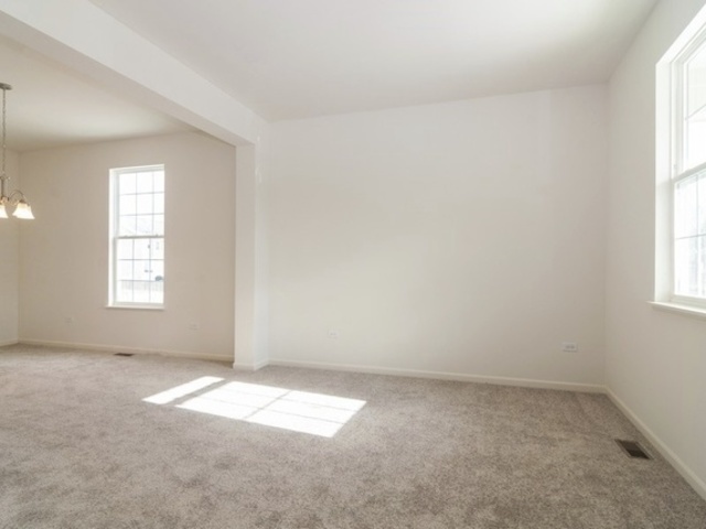 3118 Patterson Road Montgomery, IL 60538 - Photo 6 of 23 an empty room with a window