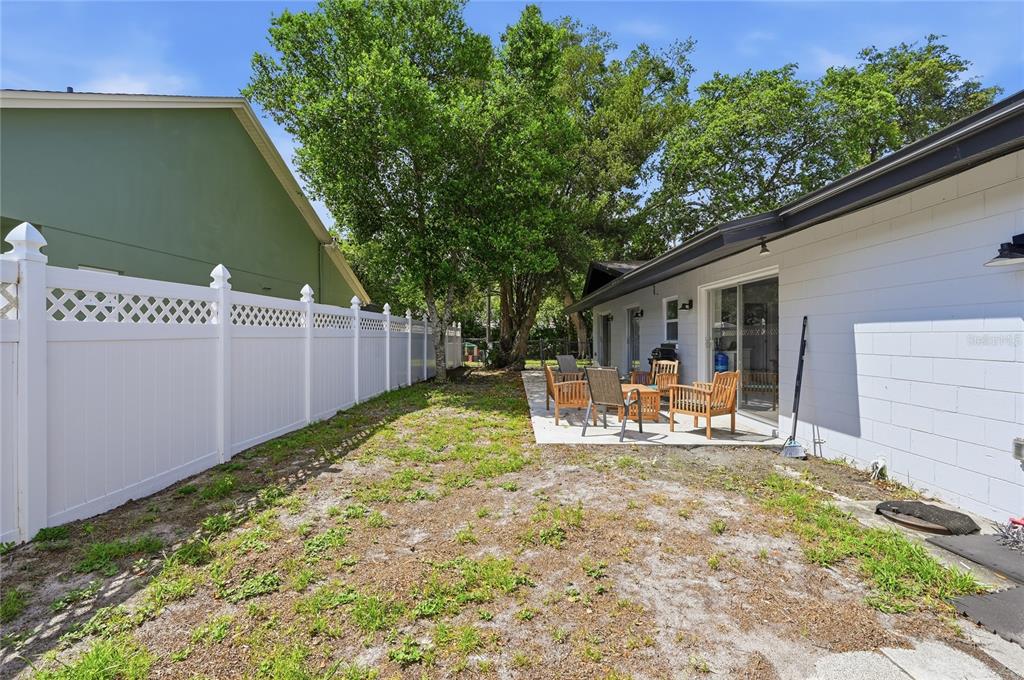 1946 Strathaven Road Winter Park, FL 32792 - Photo 35 of 37 a view of a house with backyard and sitting area