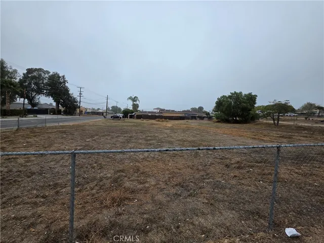 a view of a lake with houses in the background