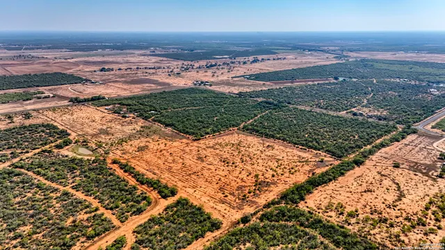 an aerial view of beach and ocean