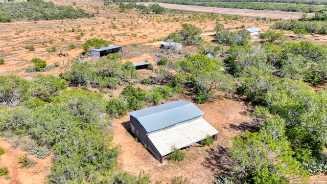a view of a field with an ocean