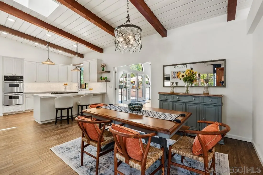 14725 Espola Road Poway, CA 92064 - Photo 12 of 50 a view of a dining room with furniture wooden floor and chandelier