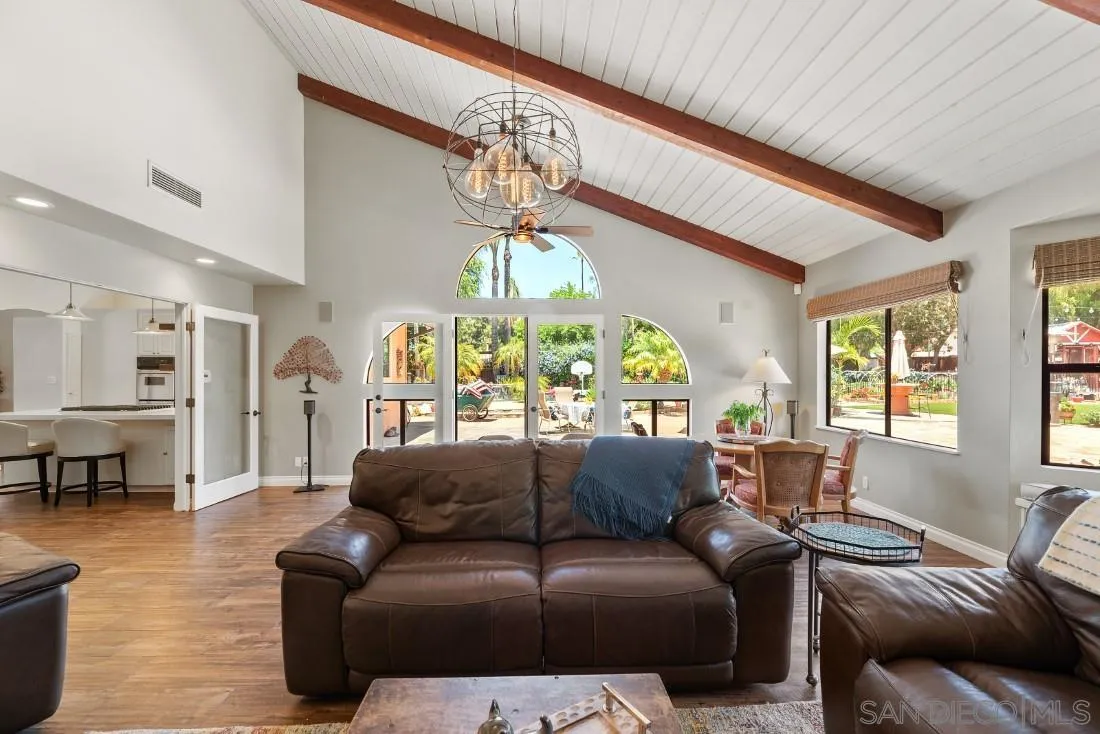 14725 Espola Road Poway, CA 92064 - Photo 15 of 50 a living room with furniture a chandelier and a large window