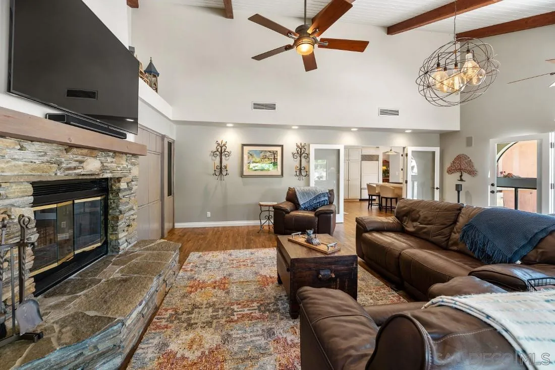 14725 Espola Road Poway, CA 92064 - Photo 16 of 50 a living room with furniture and a fireplace