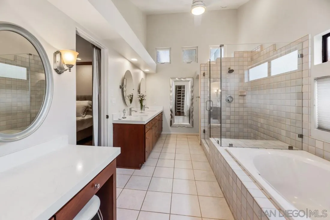 14725 Espola Road Poway, CA 92064 - Photo 20 of 50 a large spacious bathroom with a tub a mirror and shower