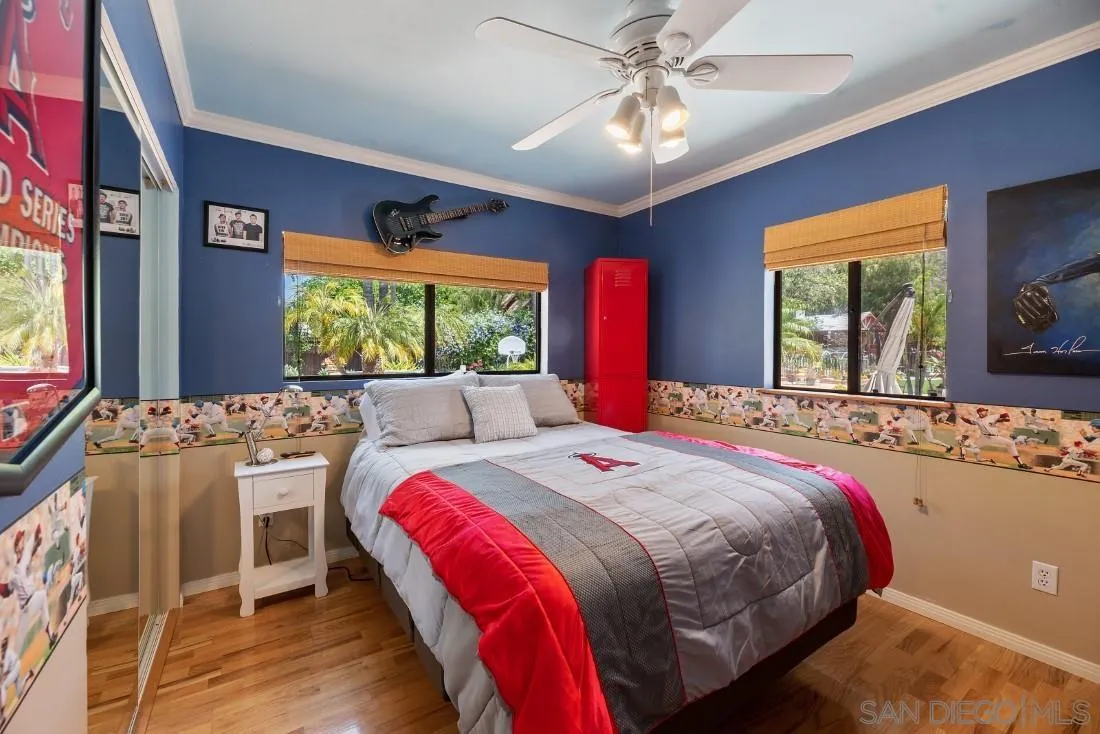 14725 Espola Road Poway, CA 92064 - Photo 23 of 50 a bed sitting in a bedroom next to a window