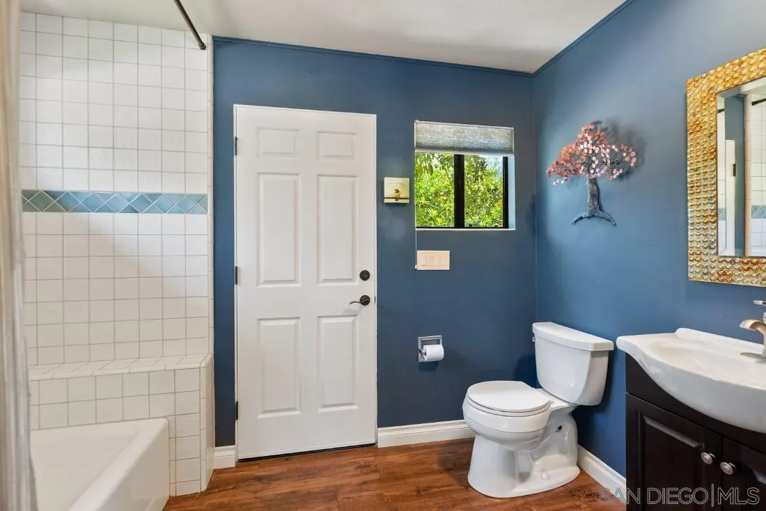 14725 Espola Road Poway, CA 92064 - Photo 27 of 50 a bathroom with a toilet a sink and shower