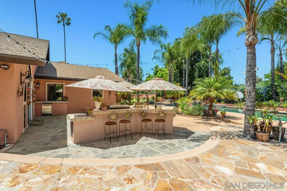 14725 Espola Road Poway, CA 92064 - Photo 33 of 50 a view of a dinning table and chairs in patio