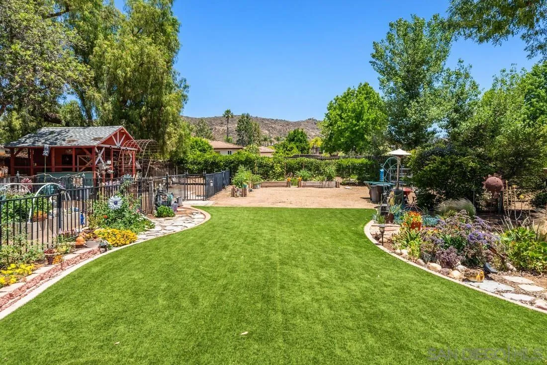 14725 Espola Road Poway, CA 92064 - Photo 38 of 50 a view of a garden with a lake view