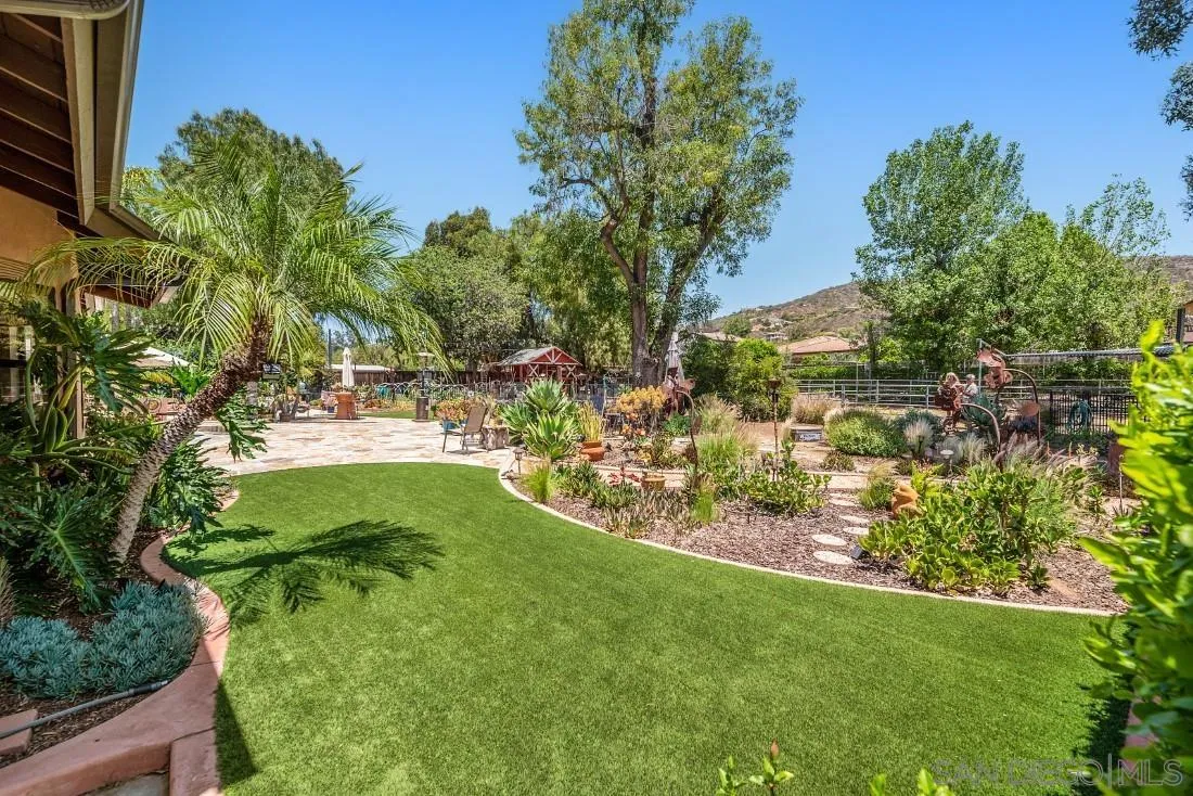 14725 Espola Road Poway, CA 92064 - Photo 40 of 50 a view of a garden with a building in the background