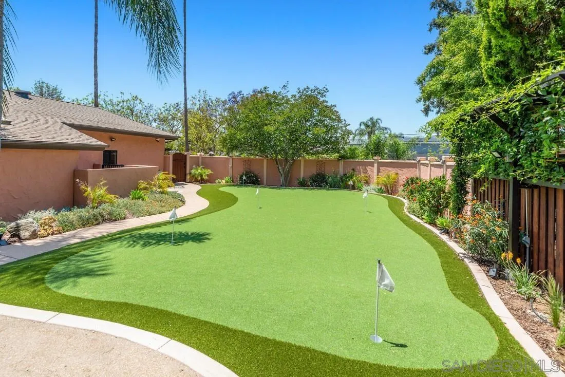 14725 Espola Road Poway, CA 92064 - Photo 4 of 50 a view of a backyard with plants and a patio