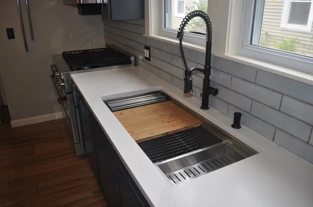 a close view of a stove and a microwave