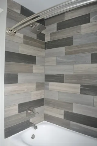 a bathroom with a sink and a shower