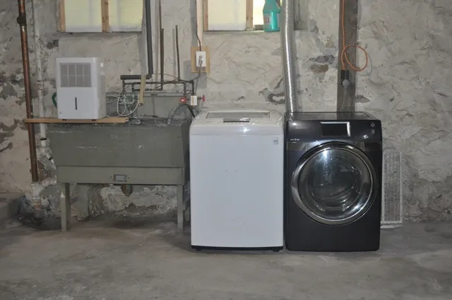 a view of a storage room washer and dryer
