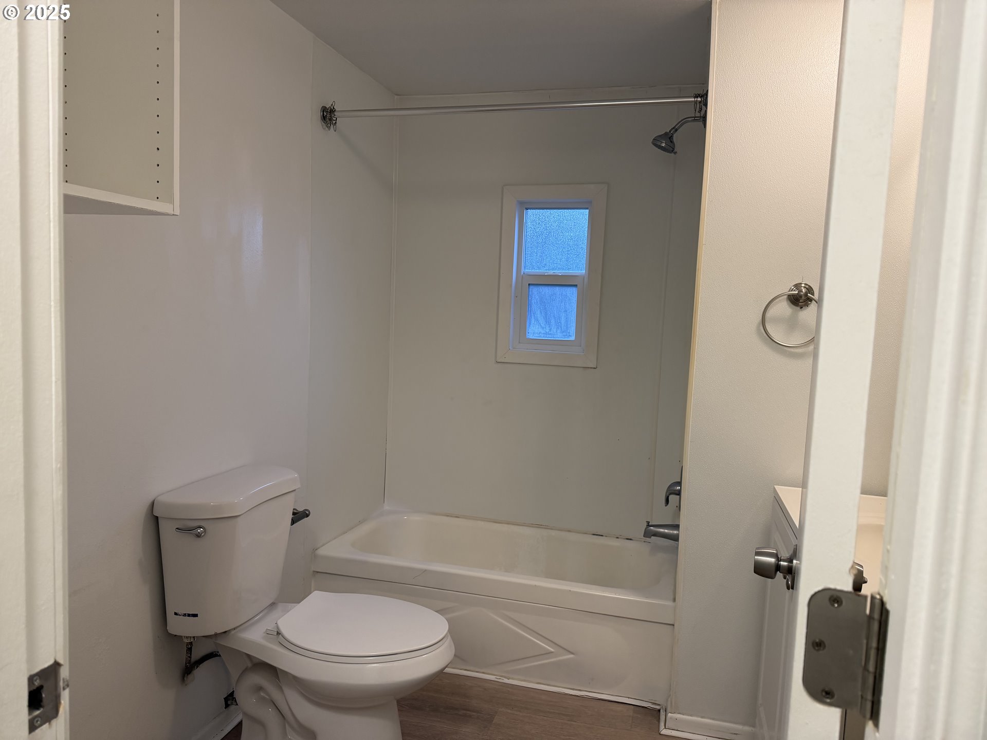 7409 Southeast 82nd Avenue, Unit 4 Portland, OR 97266 - Photo 3 of 15 a bathroom with a toilet and a bathtub