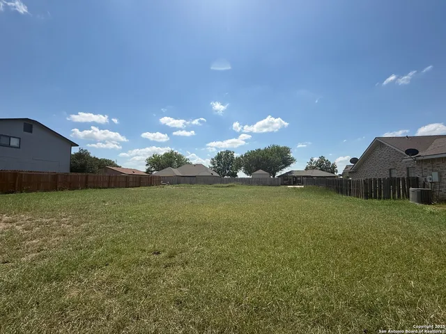 a view of a house with a big yard