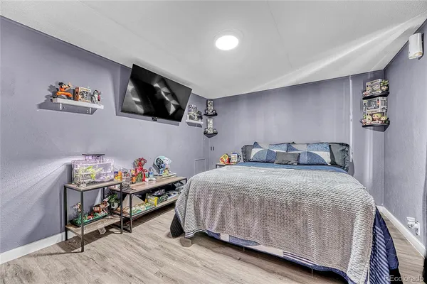 a bedroom with a bed and furniture