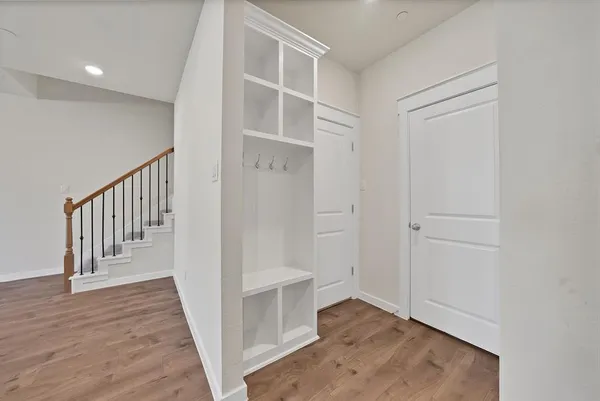 a view of entryway with wooden floor