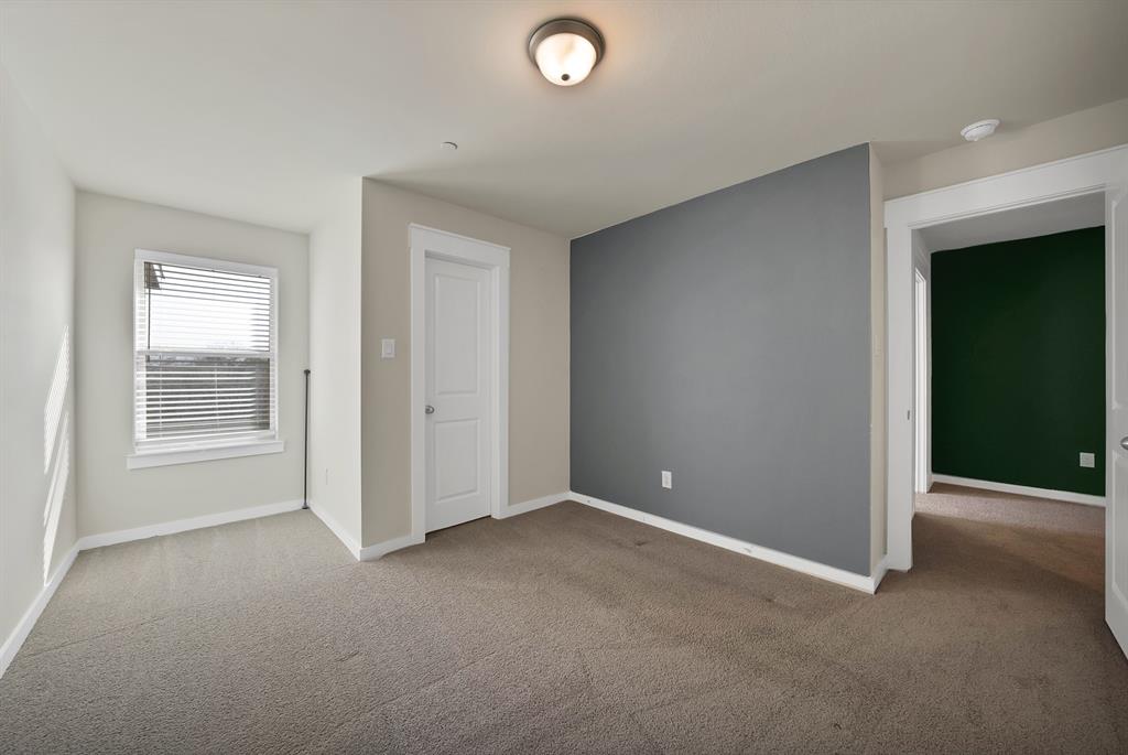 6610 Baritone Court Sachse, TX 75048 - Photo 21 of 30 an empty room with windows and closet