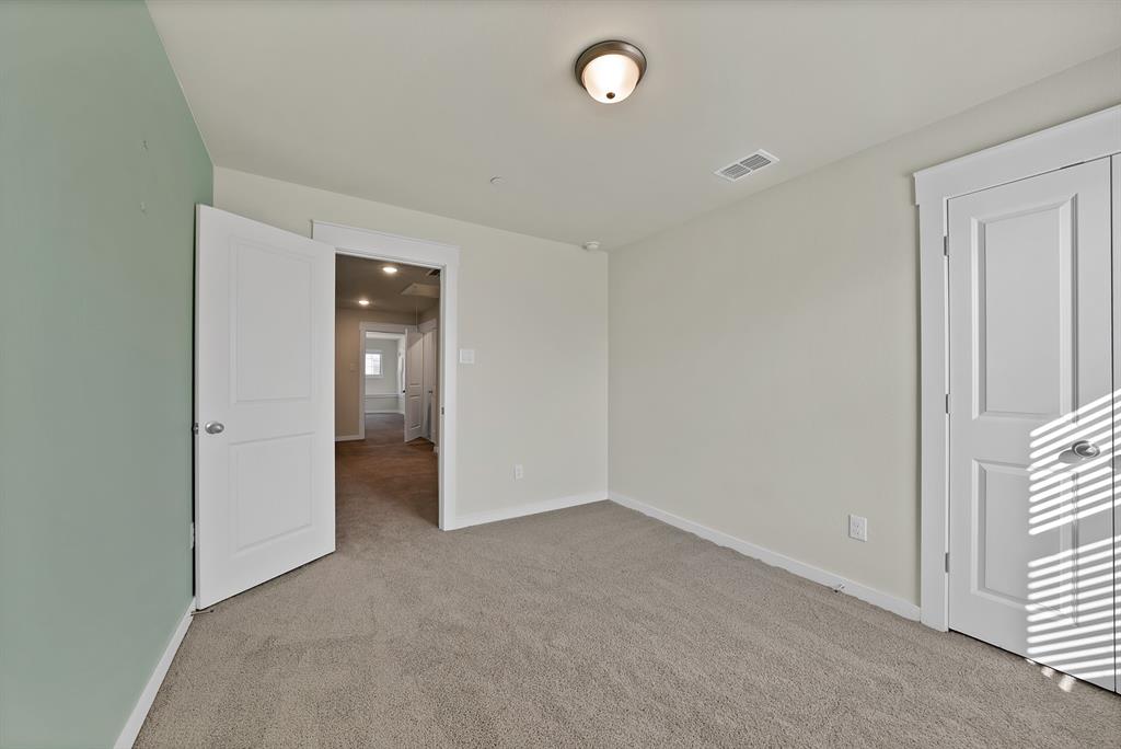 6610 Baritone Court Sachse, TX 75048 - Photo 24 of 30 an empty room with closet and a window
