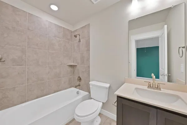a bathroom with a sink a toilet and bathtub
