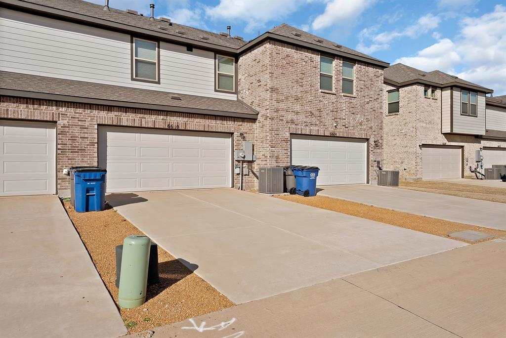 6610 Baritone Court Sachse, TX 75048 - Photo 27 of 30 a front view of a house with a yard
