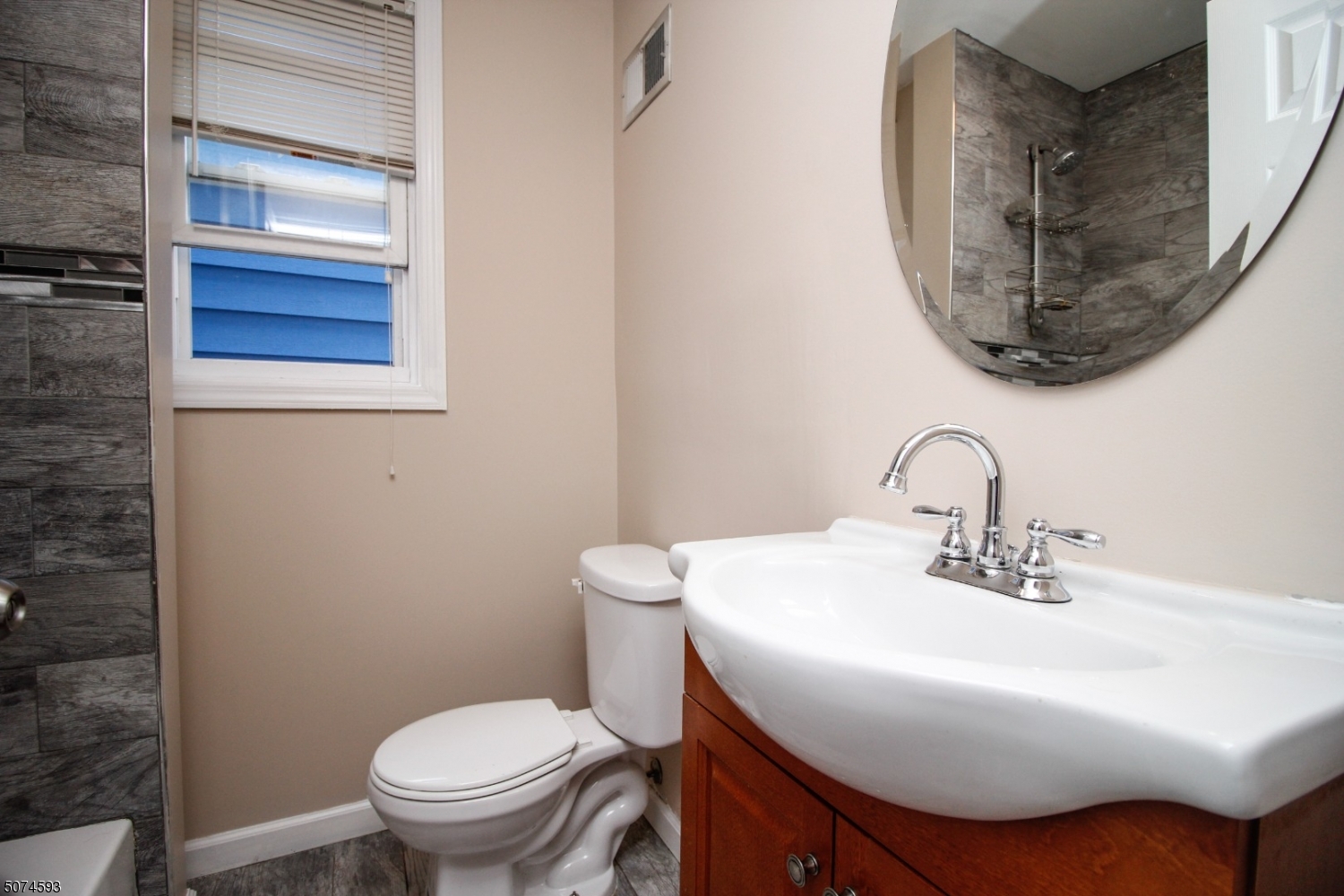 52 New Street, Unit A Montclair, NJ 07042 - Photo 6 of 18 a bathroom with a sink and a mirror