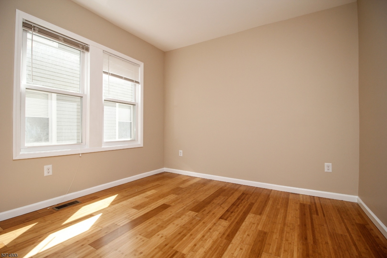 52 New Street, Unit A Montclair, NJ 07042 - Photo 9 of 18 wooden floor in an empty room with a window