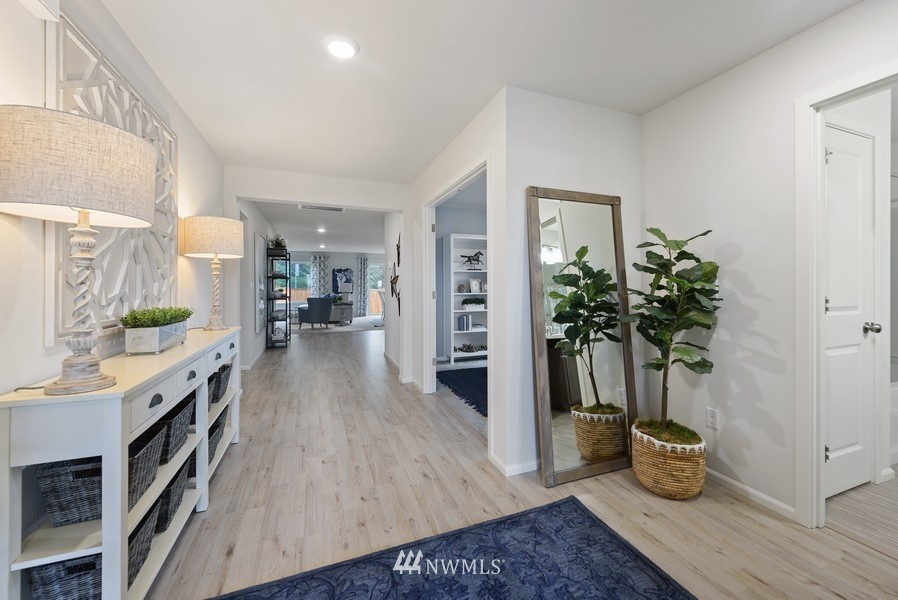 4815 Amherst Way Southwest Port Orchard, WA 98367 - Photo 2 of 12 a living room with furniture and a potted plant