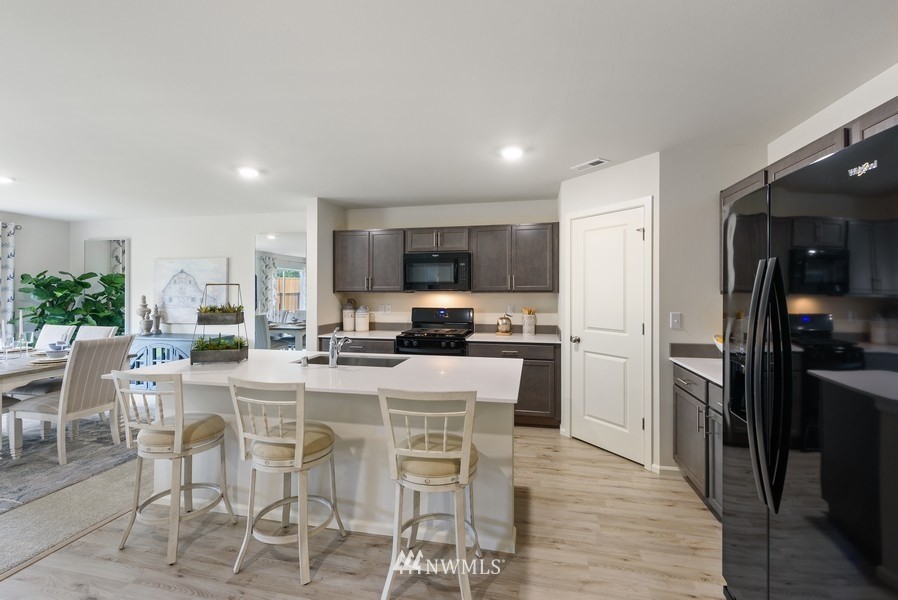 4815 Amherst Way Southwest Port Orchard, WA 98367 - Photo 4 of 12 a view of a dining room kitchen and a window