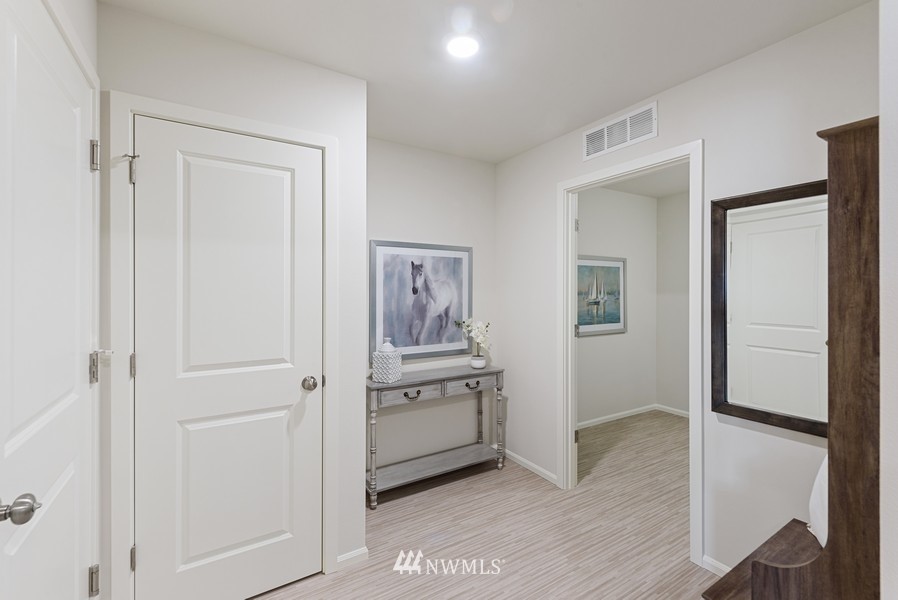 4815 Amherst Way Southwest Port Orchard, WA 98367 - Photo 6 of 12 a view of a kitchen with refrigerator and wooden floor