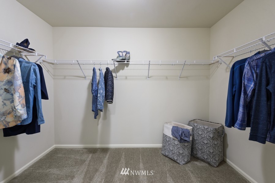 4815 Amherst Way Southwest Port Orchard, WA 98367 - Photo 9 of 12 a view of walk in closet with clothes and shoes