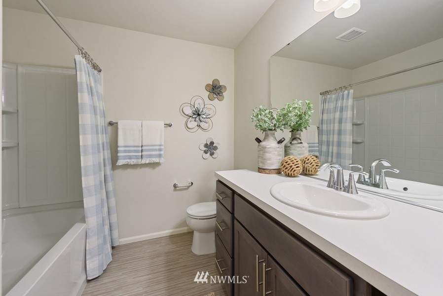 4815 Amherst Way Southwest Port Orchard, WA 98367 - Photo 10 of 12 a bathroom with a sink toilet and shower