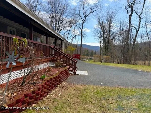a kitchen with stainless steel appliances granite countertop a refrigerator a stove a sink and a microwave