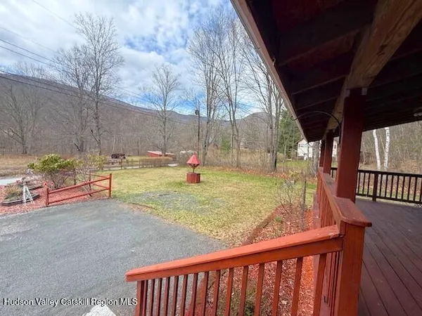 a kitchen with stainless steel appliances granite countertop a stove a sink a microwave a refrigerator and cabinets