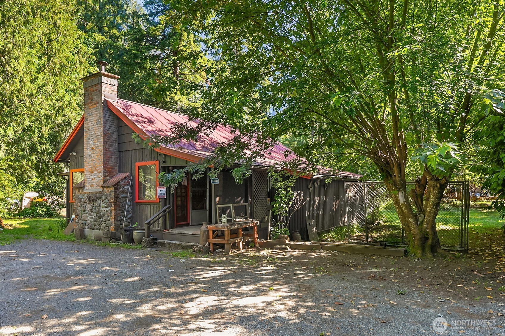a view of a house with a tree