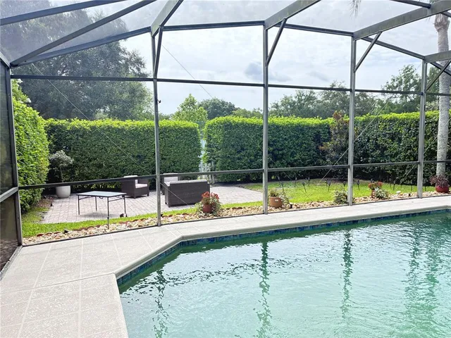 a view of a swimming pool with a porch