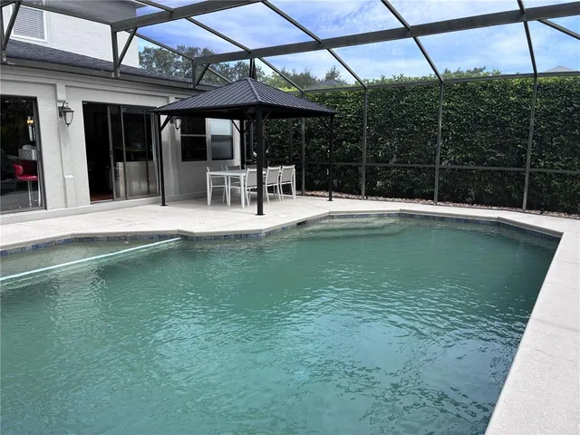 a view of a swimming pool with a patio