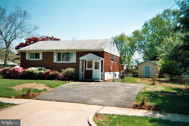 5715 Belfast Lane Springfield, VA 22150 - Photo 1 of 1 a front view of a house with a yard and garage