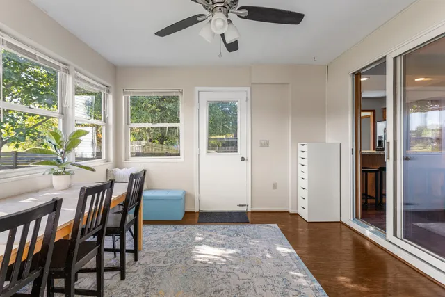 a view of a dining room with furniture window and wooden floor