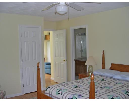 6 Wells Fargo Road Chelmsford, MA 01824 - Photo 11 of 28 a bedroom with a bed and a table in it