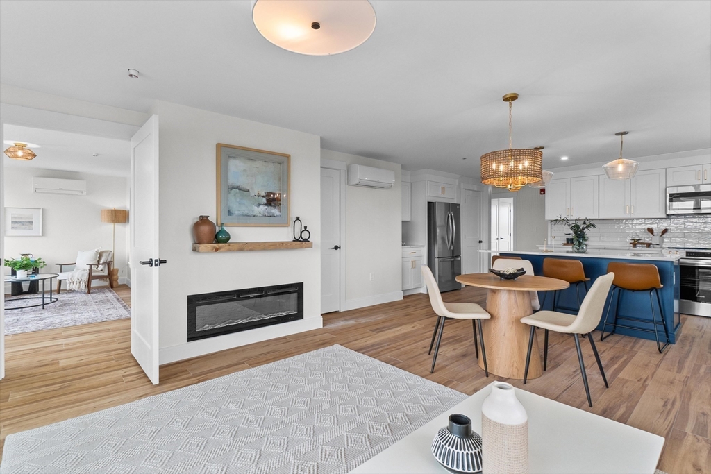 30 Cable Avenue, Unit 3 Salisbury, MA 01952 - Photo 12 of 31 a living room with furniture and a fireplace