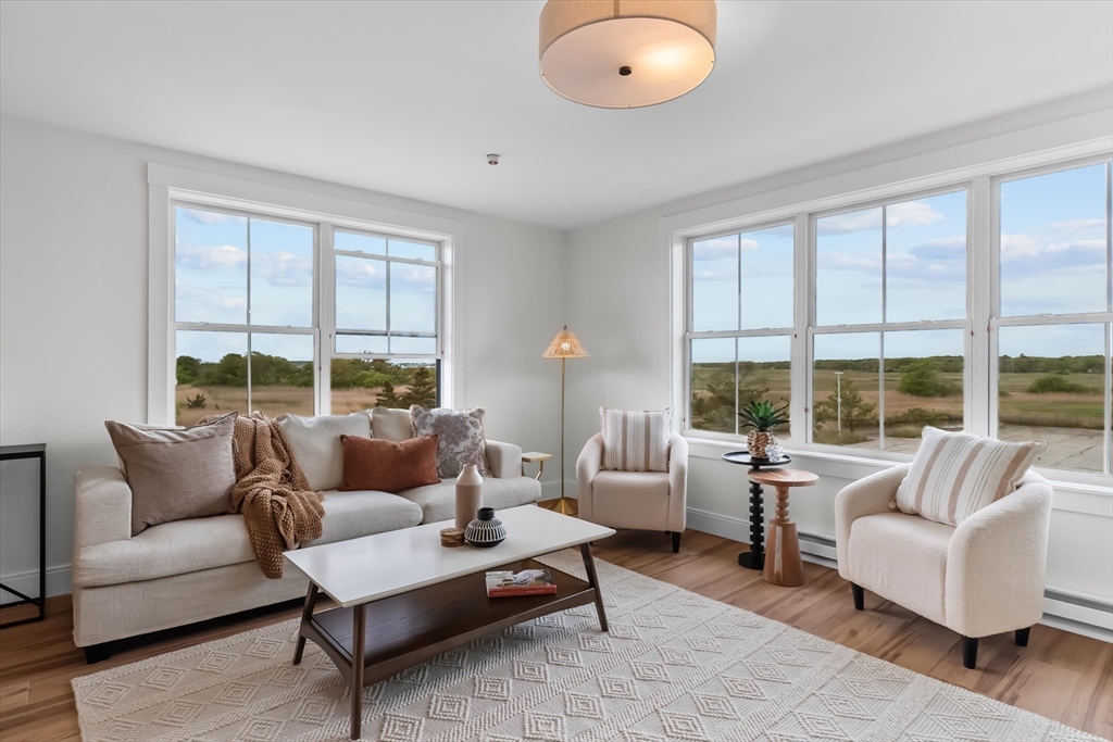 30 Cable Avenue, Unit 3 Salisbury, MA 01952 - Photo 14 of 31 a living room with furniture and a large window