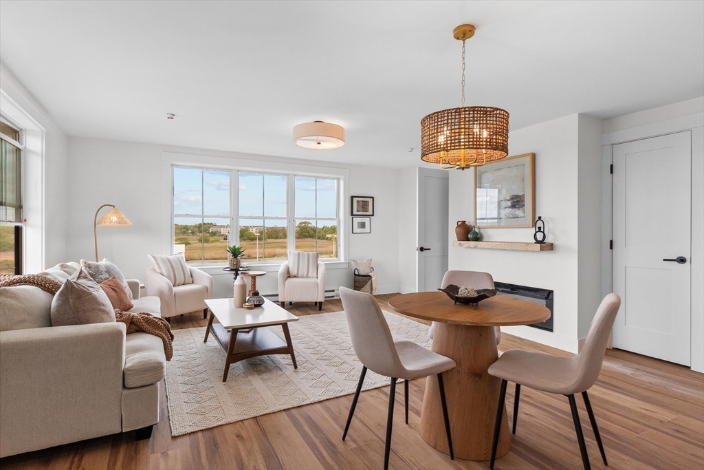 30 Cable Avenue, Unit 3 Salisbury, MA 01952 - Photo 15 of 31 a living room with furniture a rug and a large window