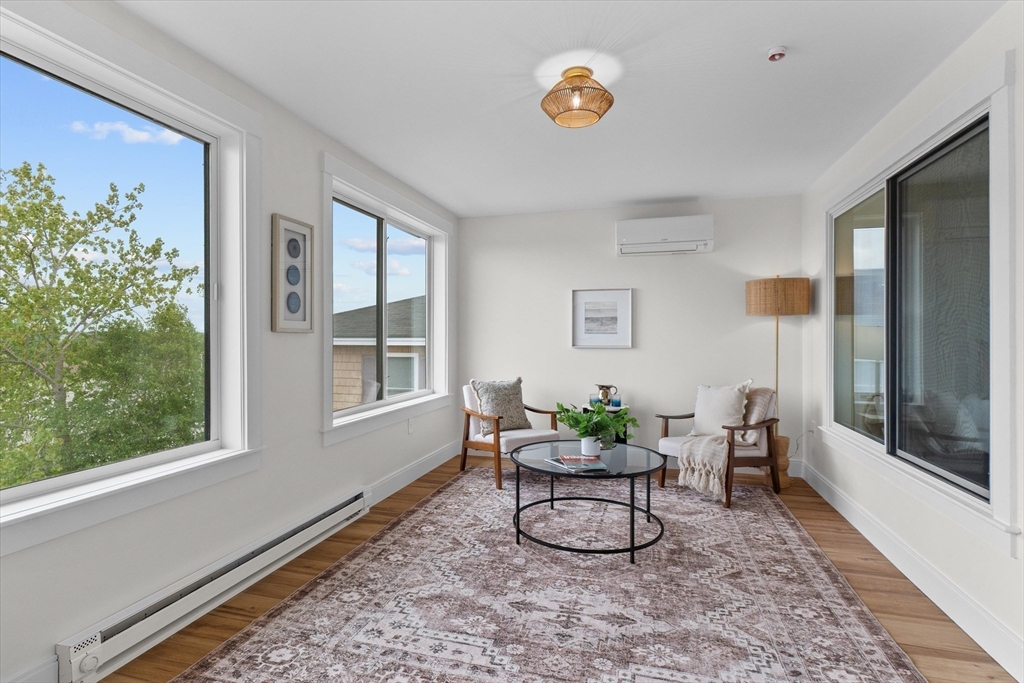 30 Cable Avenue, Unit 3 Salisbury, MA 01952 - Photo 17 of 31 a living room with furniture and a window