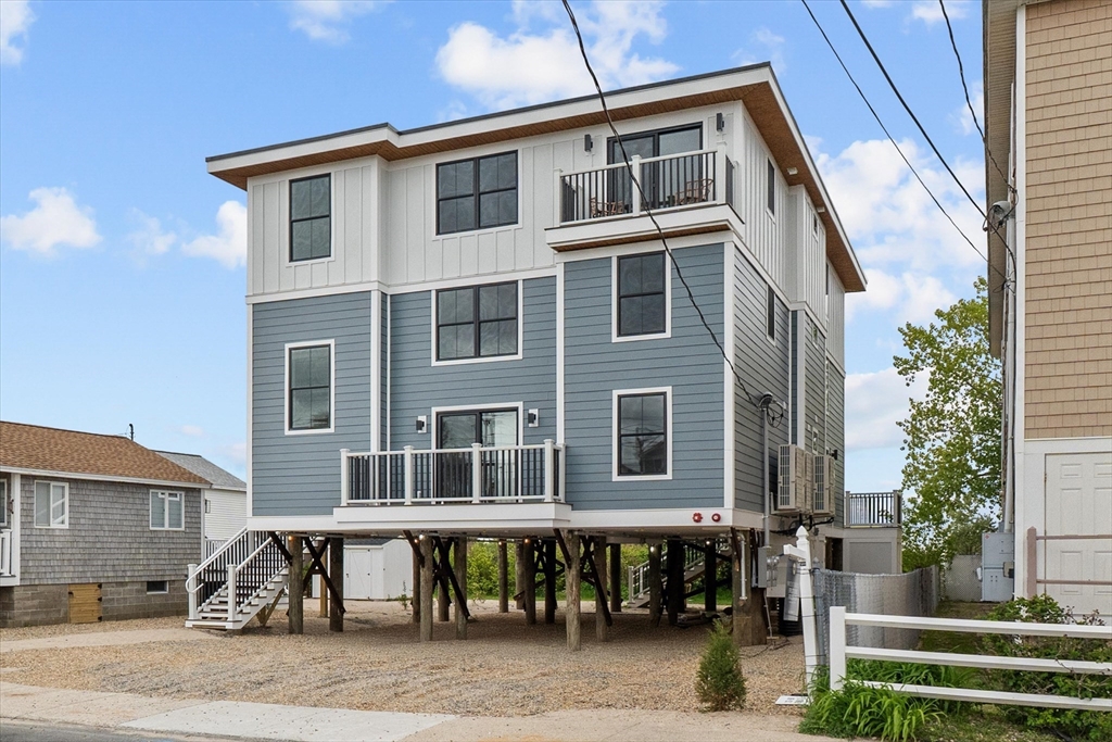 30 Cable Avenue, Unit 3 Salisbury, MA 01952 - Photo 2 of 31 a front view of a building with street