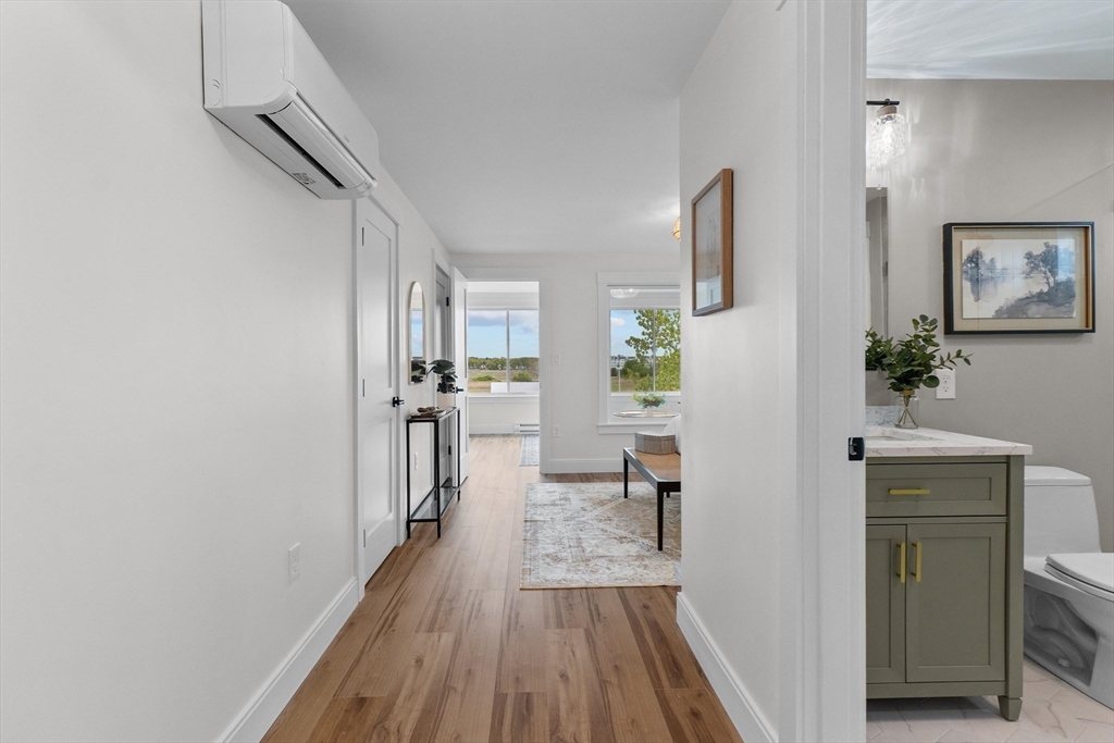 30 Cable Avenue, Unit 3 Salisbury, MA 01952 - Photo 22 of 31 a view of a hallway and a livingroom with furniture