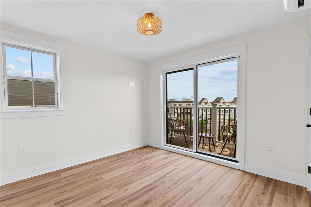 30 Cable Avenue, Unit 3 Salisbury, MA 01952 - Photo 25 of 31 a view of a room with wooden floor and a window